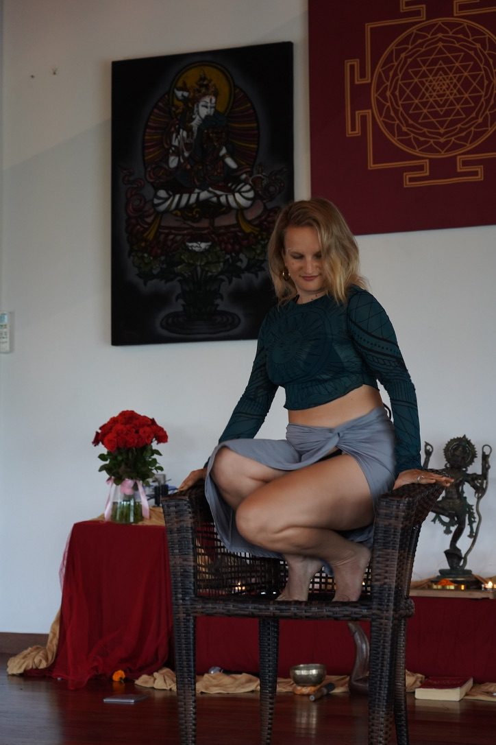 Amanda seated in a ceremonial room