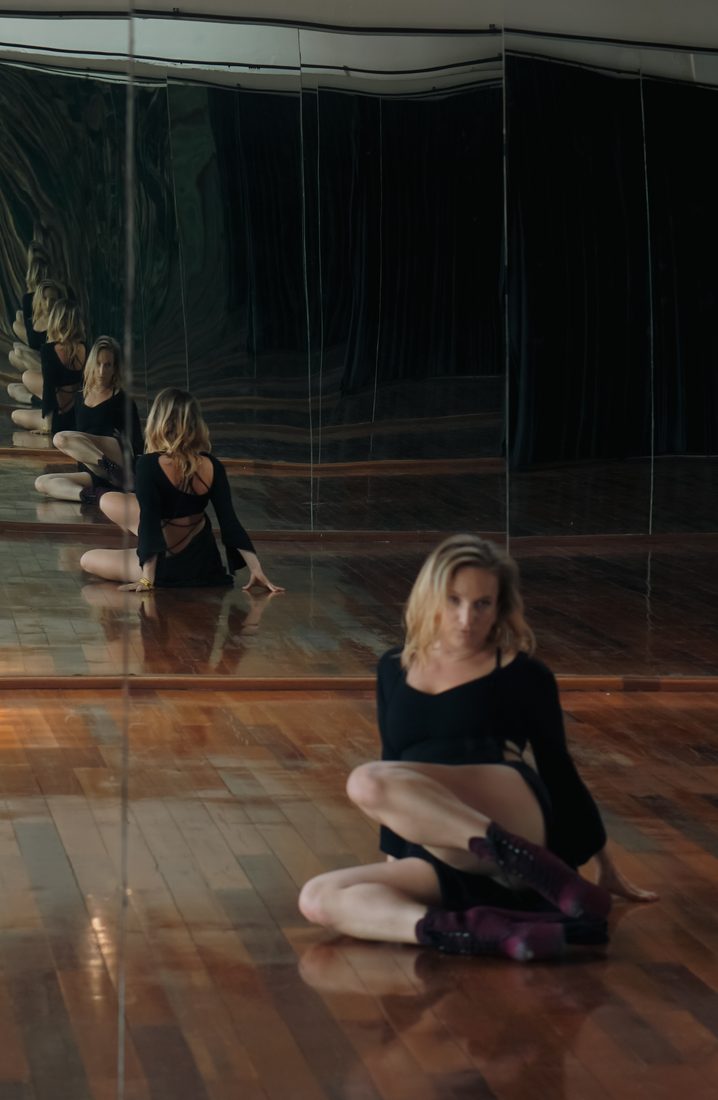 Amanda in a mirrored dance studio